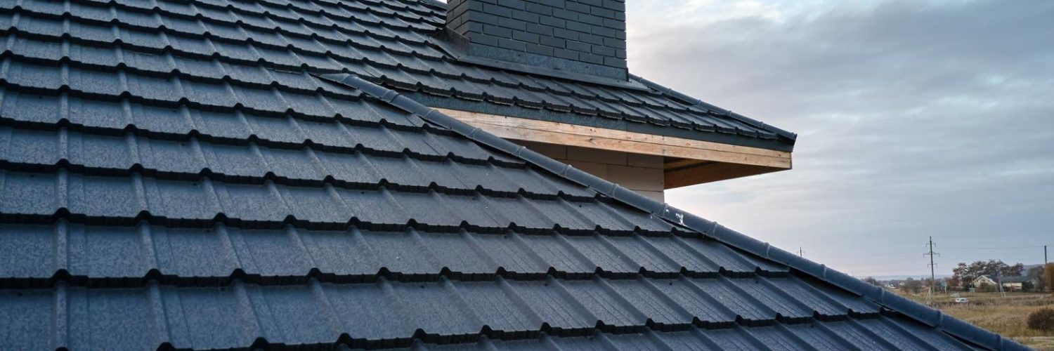 closeup-of-house-roof-top-covered-with-metallic-sh-2023-11-27-05-35-27-utc.jpg